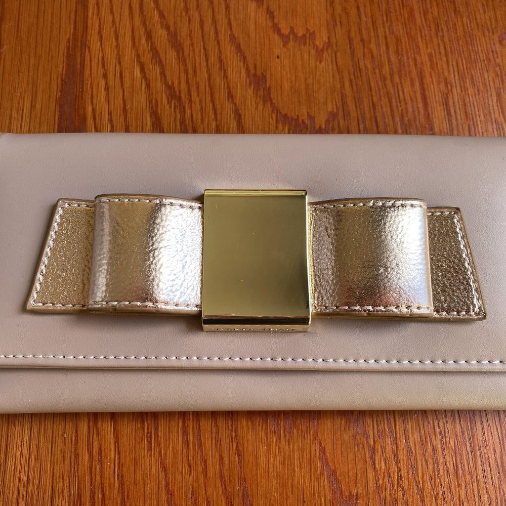 Brand New with tag Ivanka Trump pink bow wallet with gold hardware
